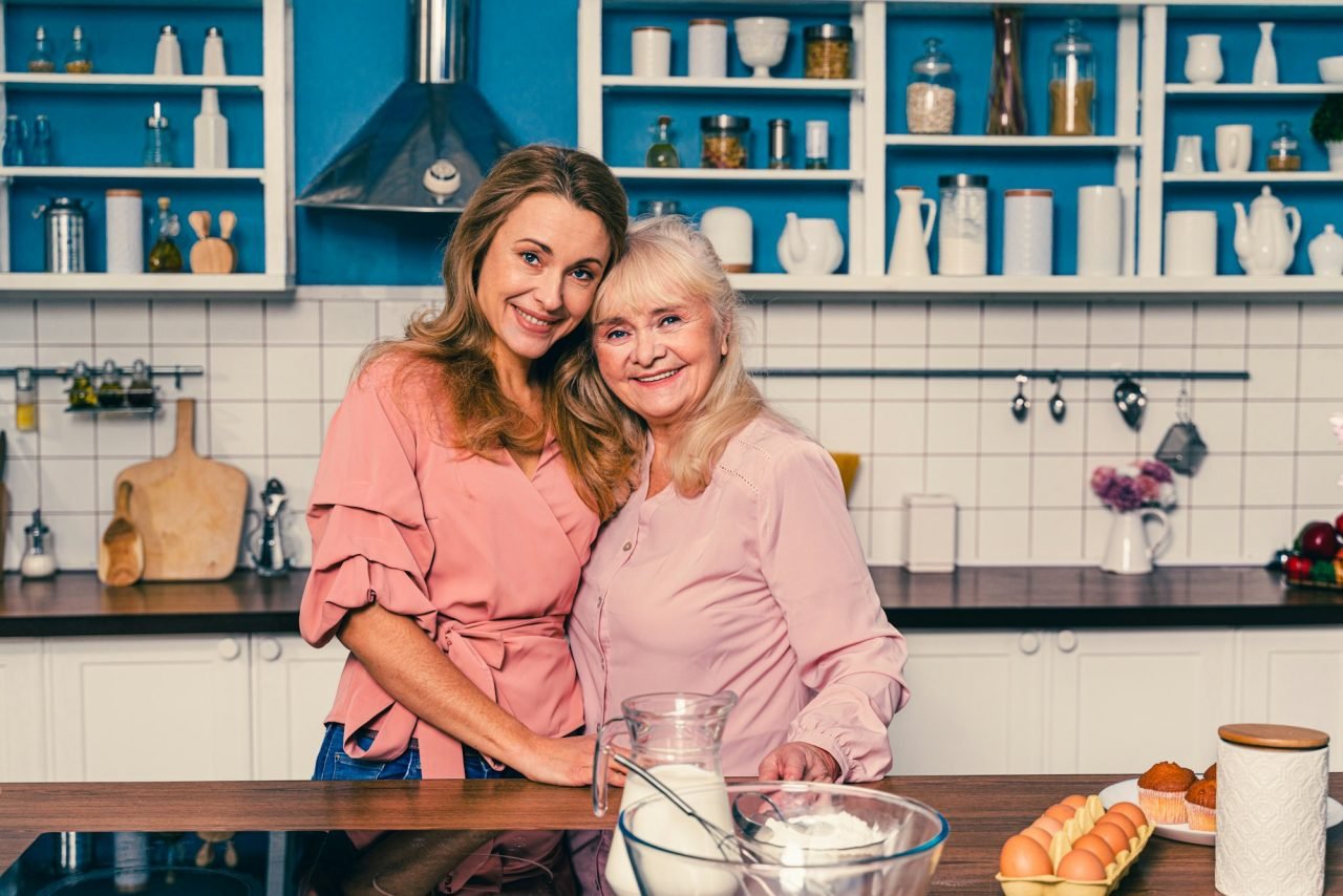 beautiful senior woman and daughter baking in the kitchen 1